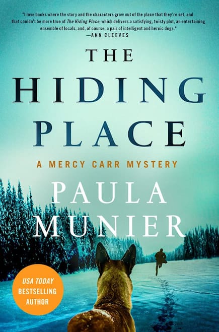 Book Cover for The Hiding Place by Paula Munier showing a scene looking over the shoulder of a dog into a snowy wilderness with a person in the distance.